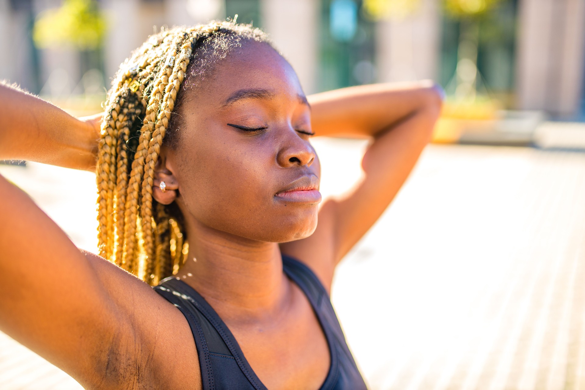 latin brazilian woman in yellow hoody with yellow pigtails dreadlocks in the street took to the public park and streets to protest feminism