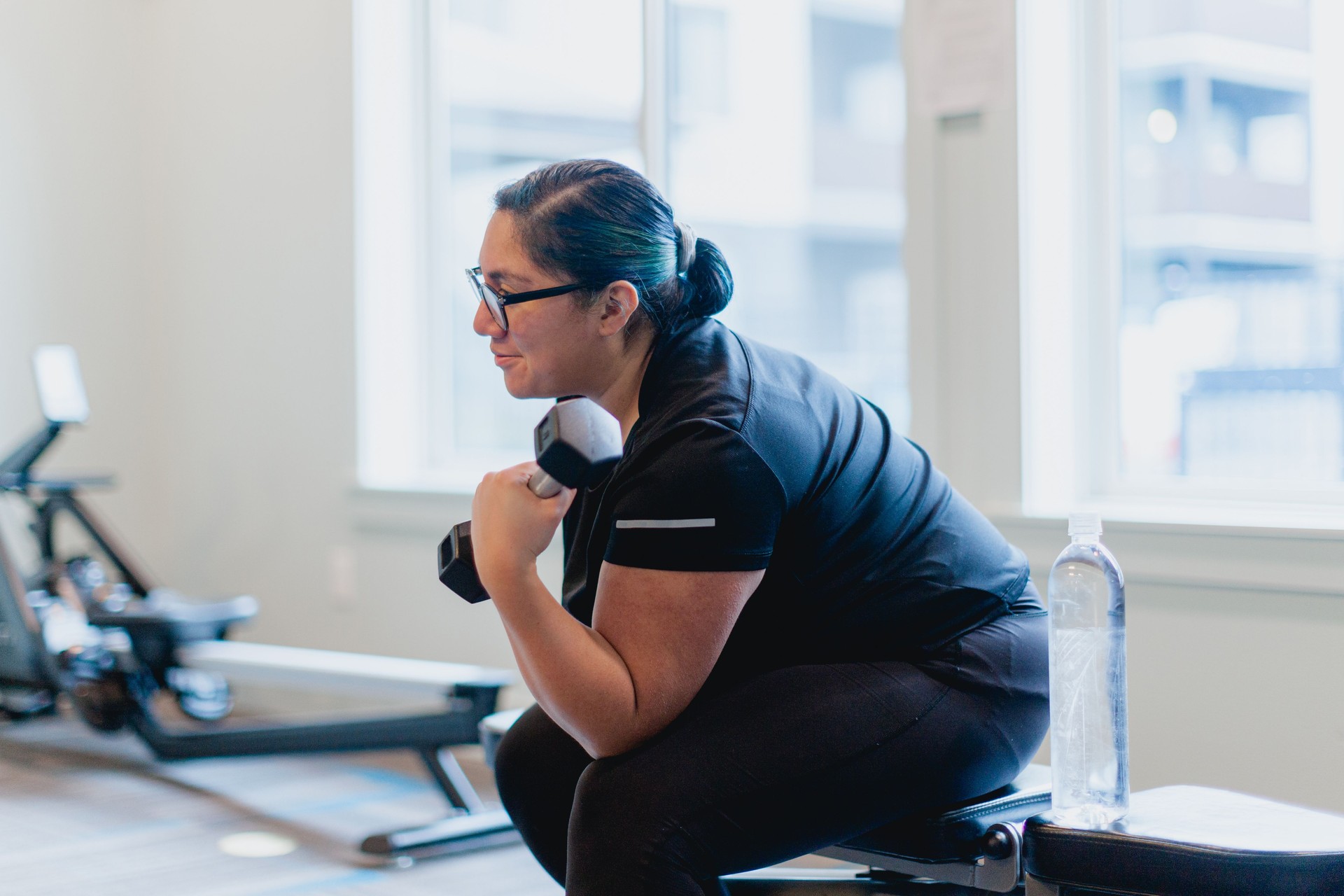 Motivated Woman Working Out in Gym